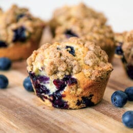 freshly baked blueberry oat muffins with an oat crumble topping