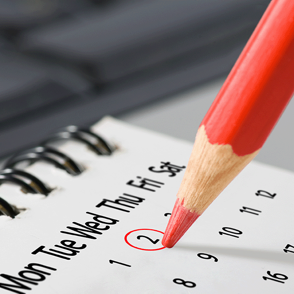 Desktop calendar with date circled in red pencil