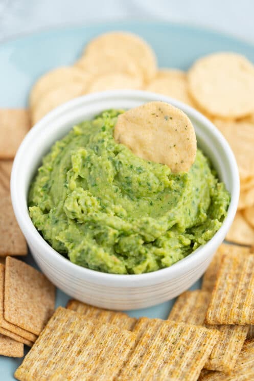 green goddess hummus with whole grain crackers for dipping