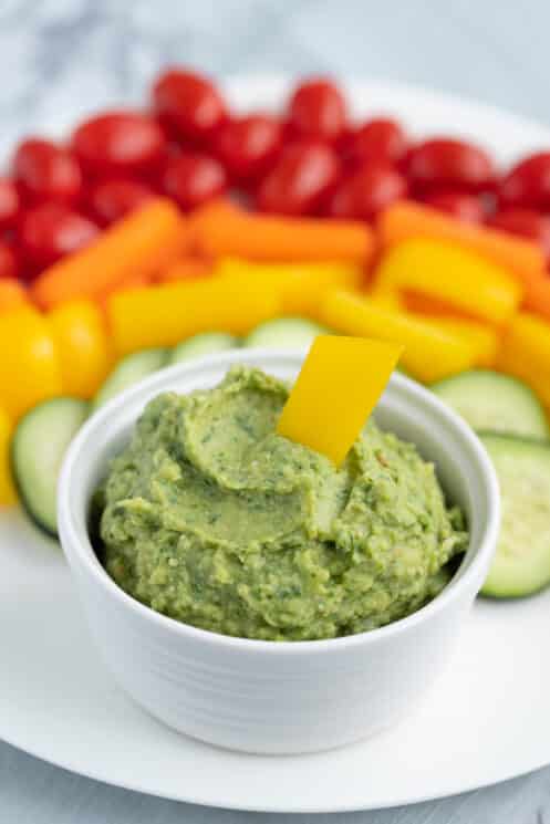 green goddess hummus with colorful veggies to dip