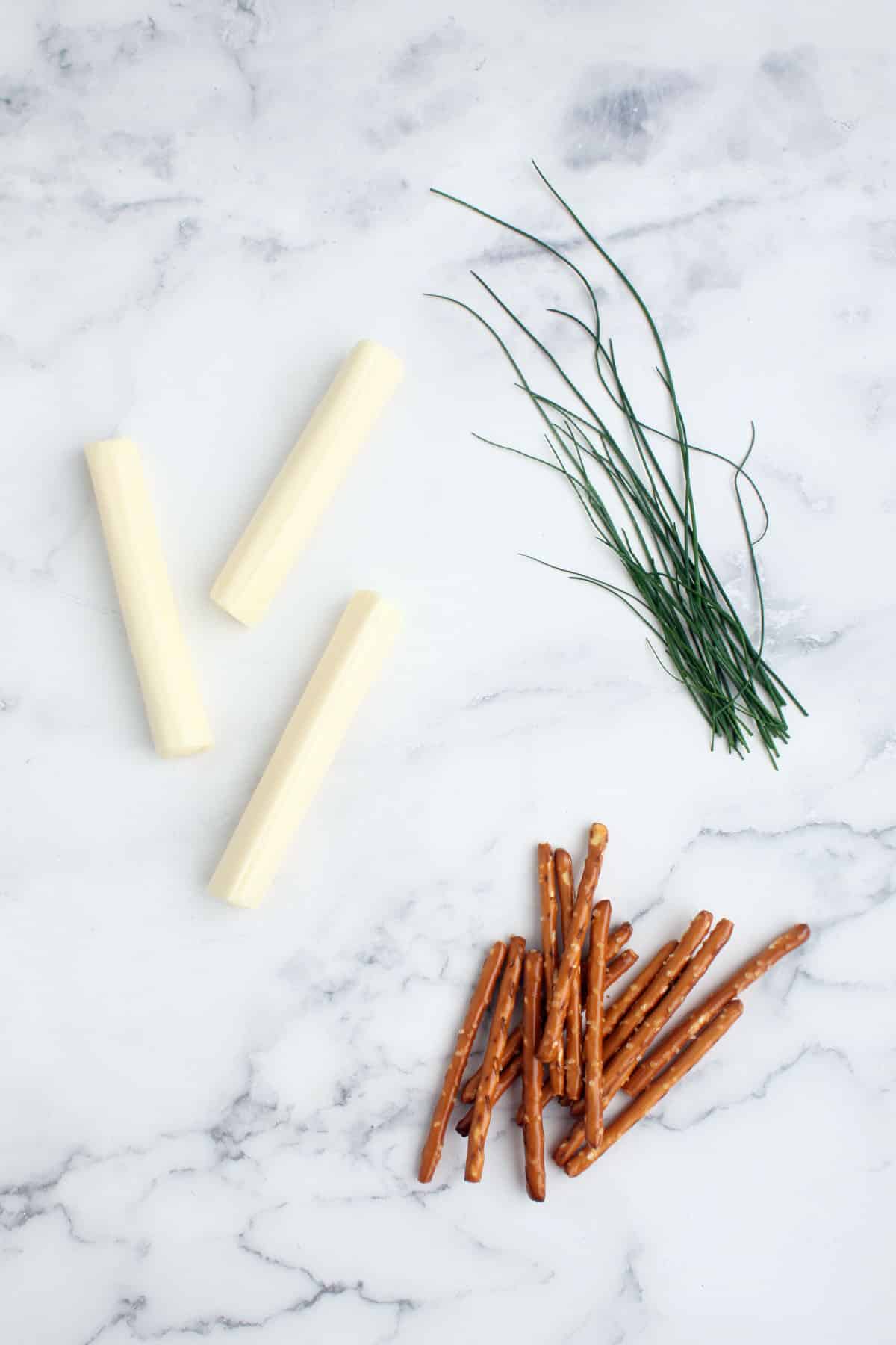 string cheese, chives, and pretzel sticks