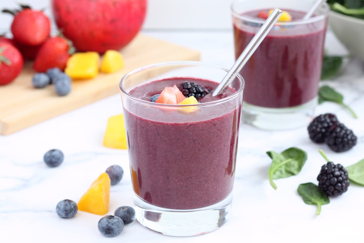 immune boosting berry smoothie in glass with straw
