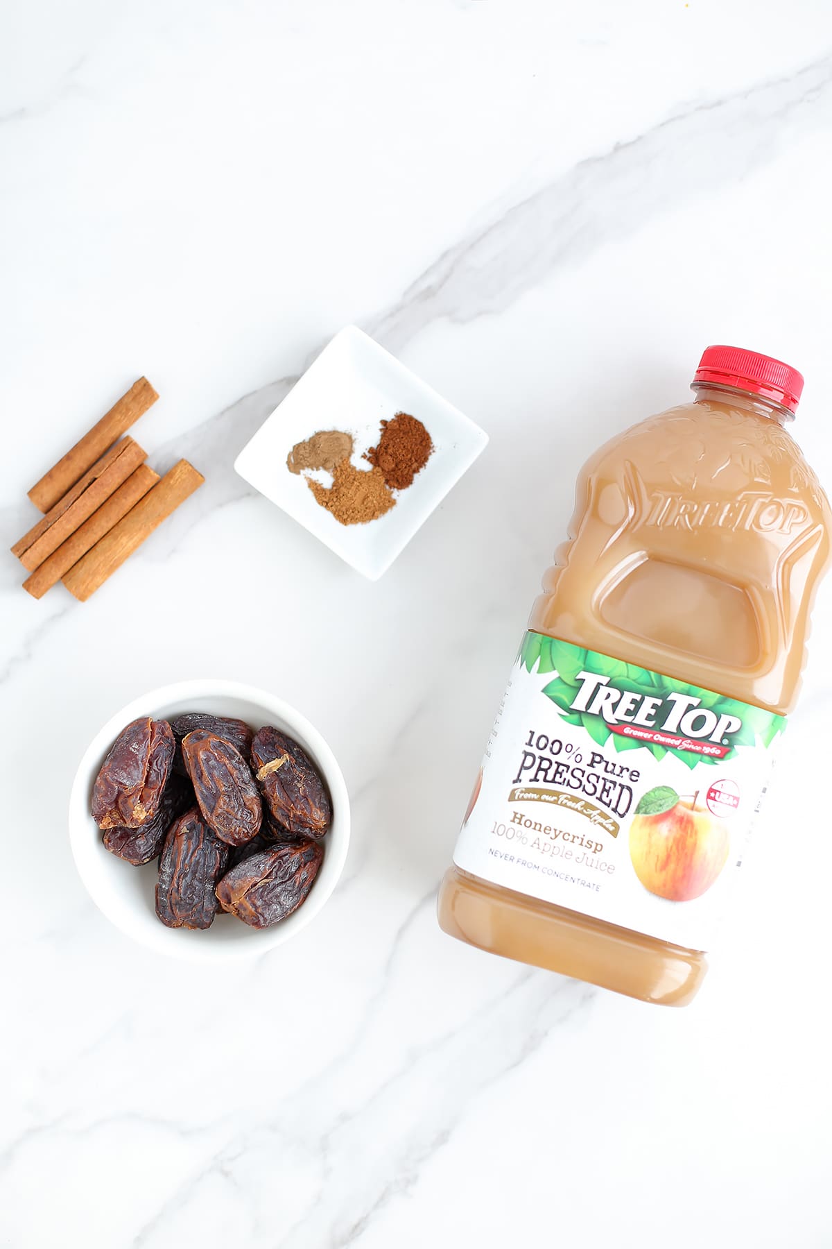 Ingredients needed to make homemade caramel apple cider. 