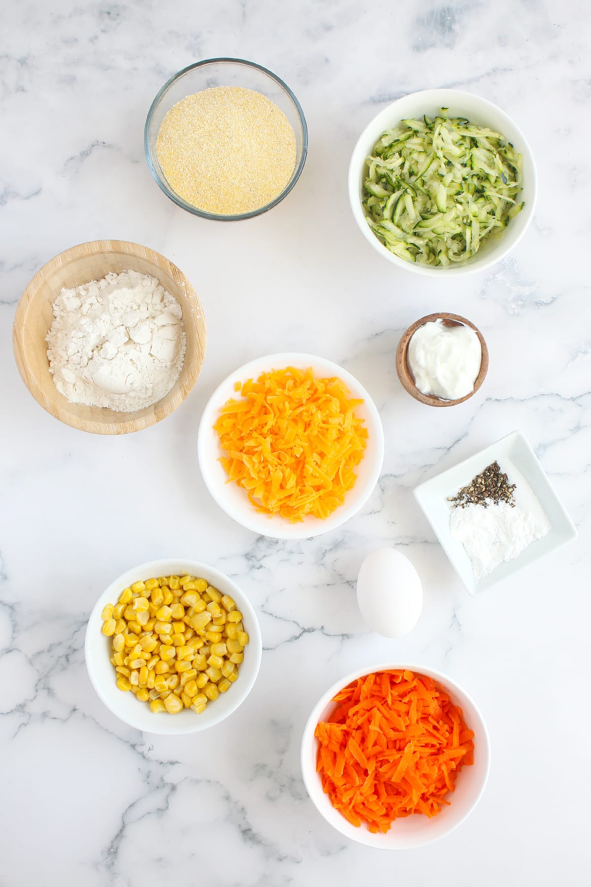 Ingredients you need to make homemade zucchini fritters. 
